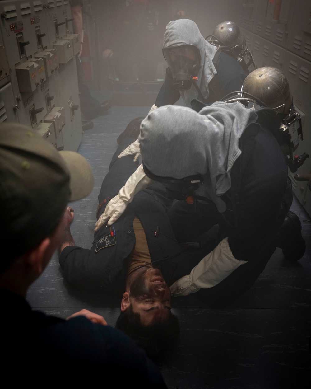 Nimitz Sailors Assess Casualties During Class Bravo Fire Drill