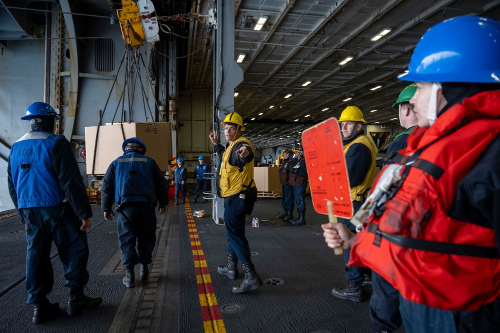 Nimitz Sailor Instructs Signalman During Resupply At Sea