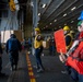 Nimitz Sailor Instructs Signalman During Resupply At Sea