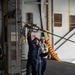 Nimitz Sailor Trips Pelican Hook During Resupply At Sea