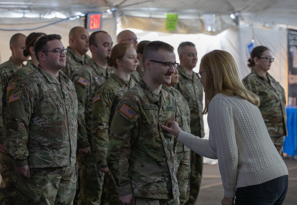 338th Army Band Promotes Spc. Ryan Miller at Zehnder’s Snowfest