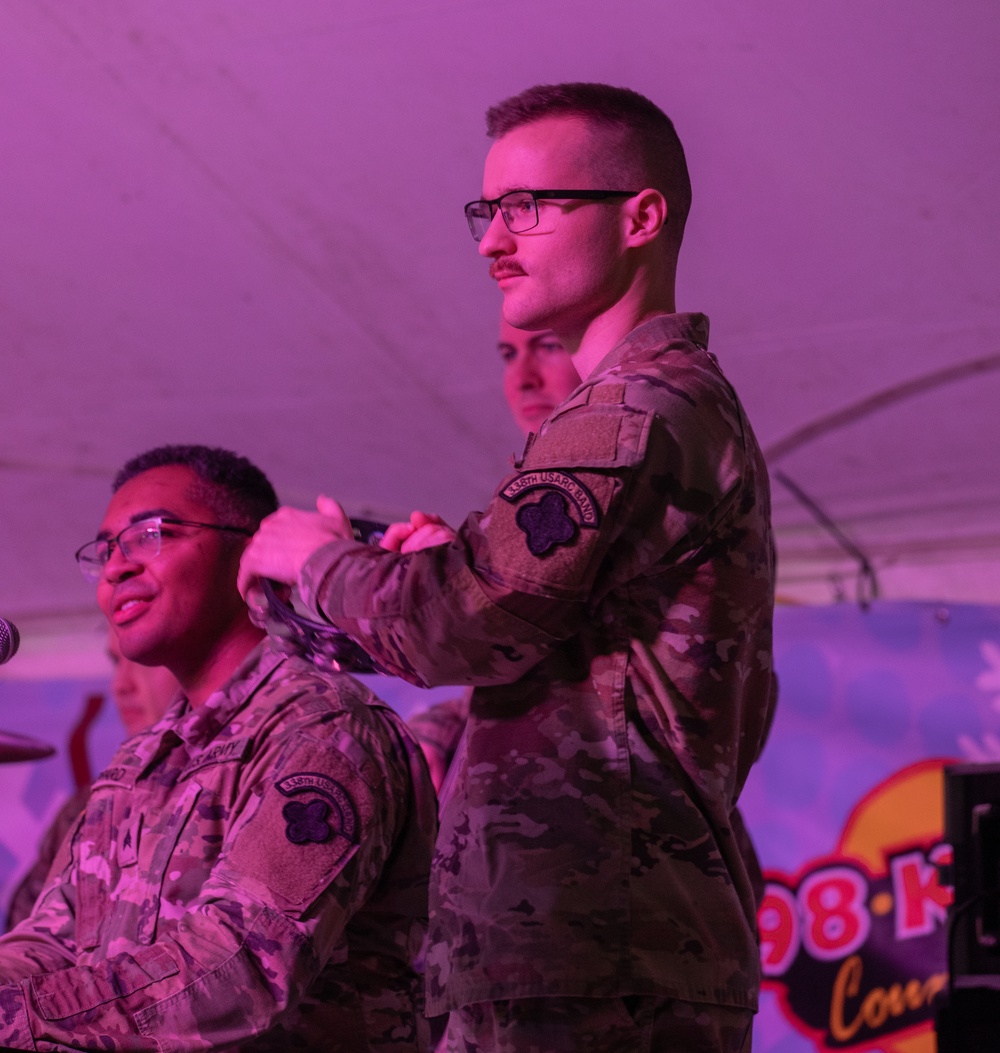 338th Army Band Promotes Spc. Ryan Miller at Zehnder’s Snowfest