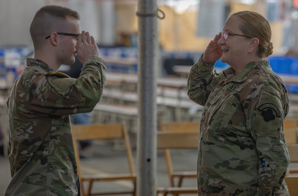 338th Army Band Promotes Spc. Ryan Miller at Zehnder’s Snowfest