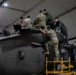 Multinational forces conduct repairs on UH60M Black Hawk