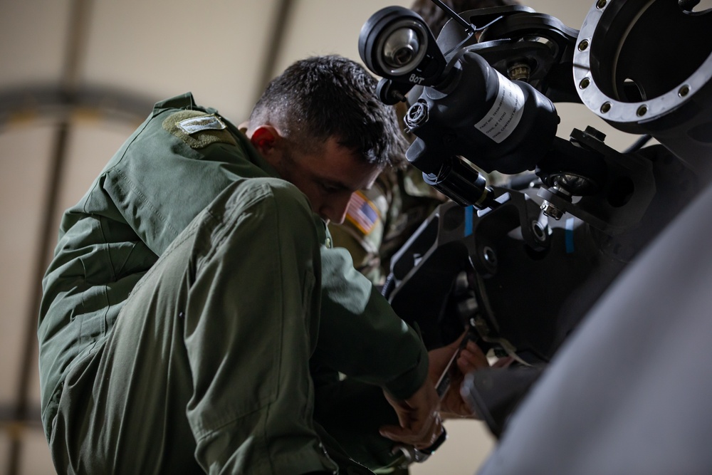 Multinational forces conduct repairs on UH60M Black Hawk