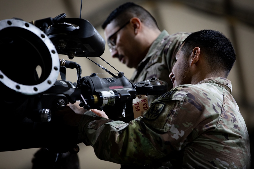 Multinational forces conduct repairs on UH60M Black Hawk