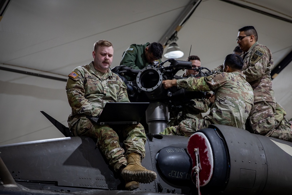 Multinational forces conduct repairs on UH60M Black Hawk