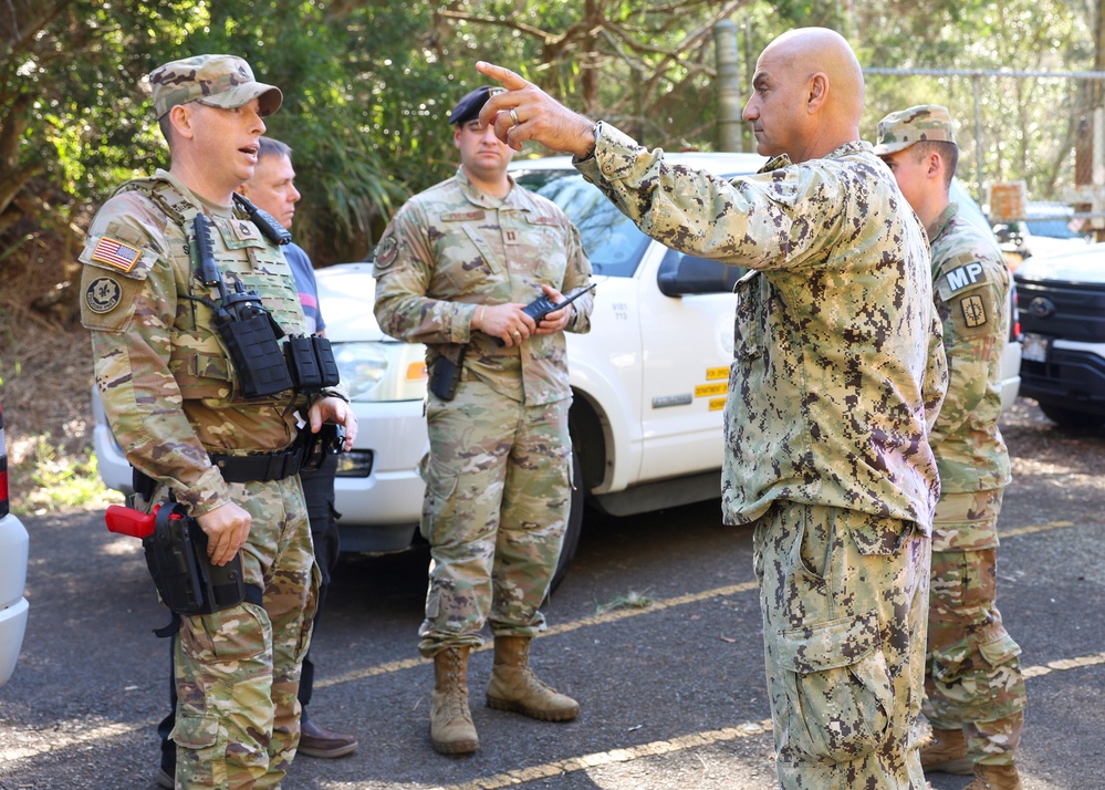 Joint Base Pearl Harbor-Hickam Commander, Capt. Samuel White, interacts with safety personnel at an injection point at Lualualei Naval Complex Feb. 5, 2025.