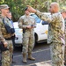 Joint Base Pearl Harbor-Hickam Commander, Capt. Samuel White, interacts with safety personnel at an injection point at Lualualei Naval Complex Feb. 5, 2025.