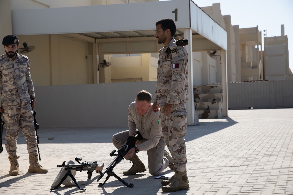 Qatar National Service Academy weapons instructor demonstrates proper weapons assembly
