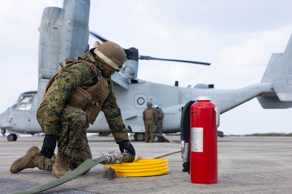 Marines arm and refuel for aerial gunnery target shoot off the coast of Okinawa