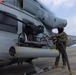 Marines arm and refuel for aerial gunnery target shoot off the coast of Okinawa