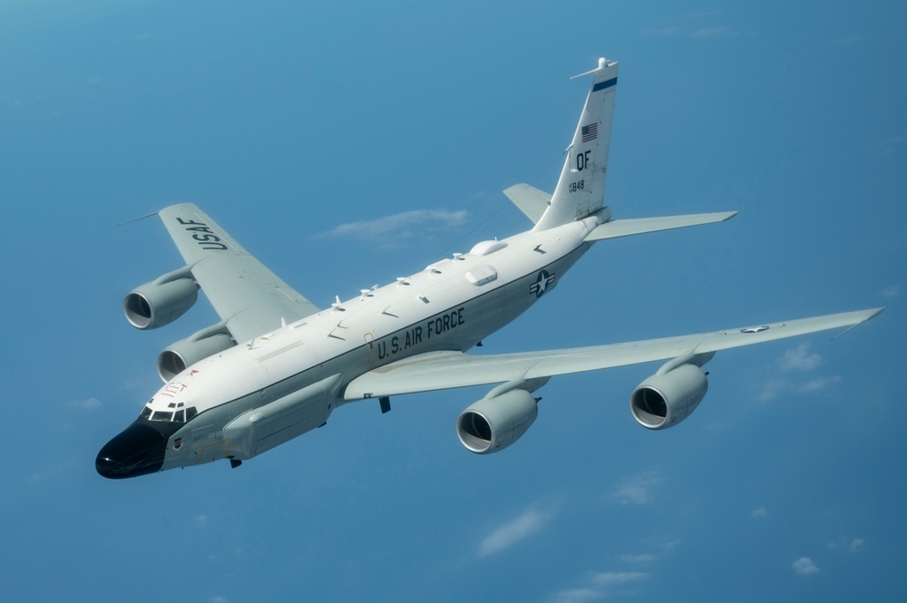 RC-135 refueled above the clouds