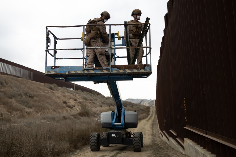U.S. Marines reinforce southern border wall with concertina wire