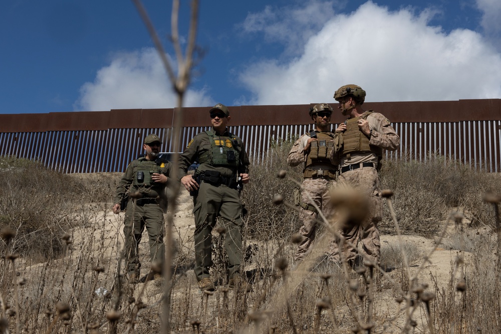 U.S. Marines reinforce southern border wall with concertina wire