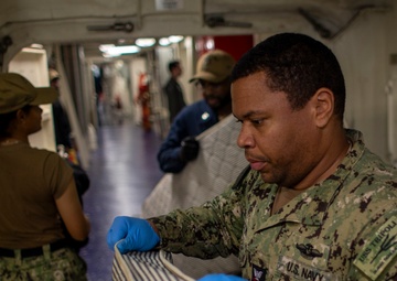 USS Tripoli Sailors Conduct Inspections and Move Mattresses