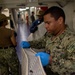 USS Tripoli Sailors Conduct Inspections and Move Mattresses