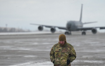 U.S. Air Force Chief Master Sgt. walks along flightline