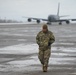 U.S. Air Force Chief Master Sgt. walks along flightline