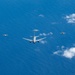 U.S., JASDF and RAAF aircraft fly in formation during CN25