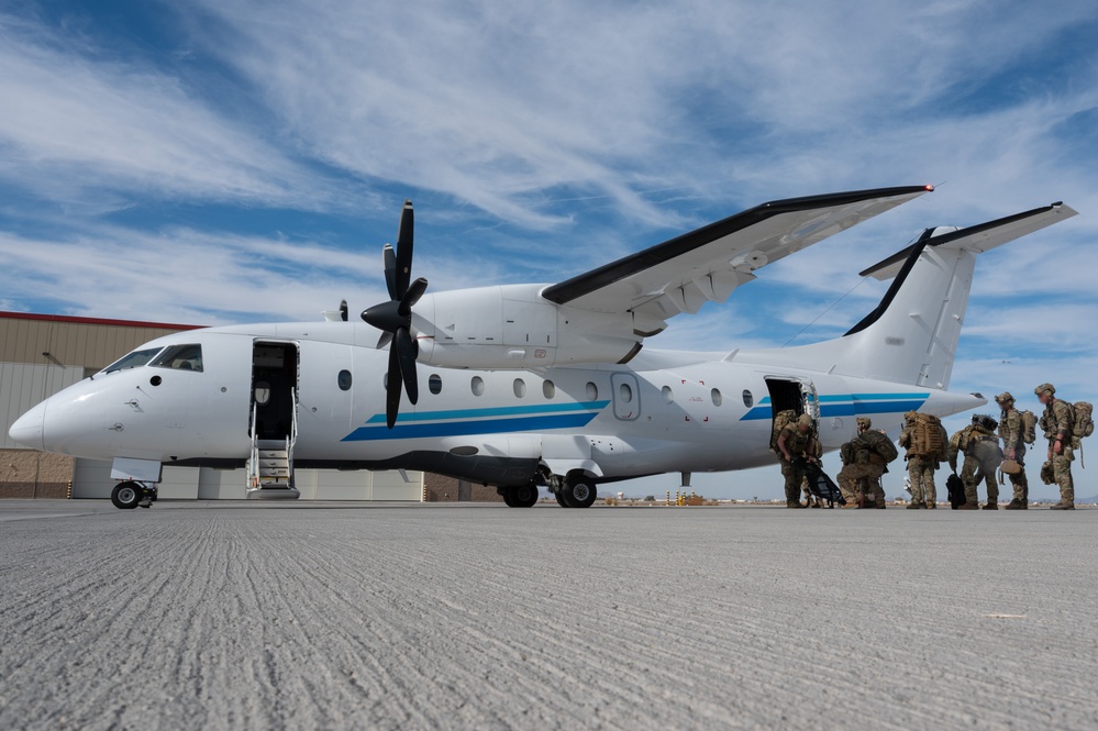 U.S. Air Force and Italian Air Commandos conduct medical training on a C-146A Wolfhound during Emerald Warrior 25.1