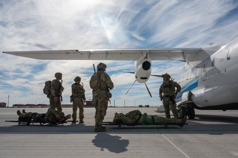 U.S. Air Force and Italian Air Commandos conduct medical training on a C-146A Wolfhound during Emerald Warrior 25.1