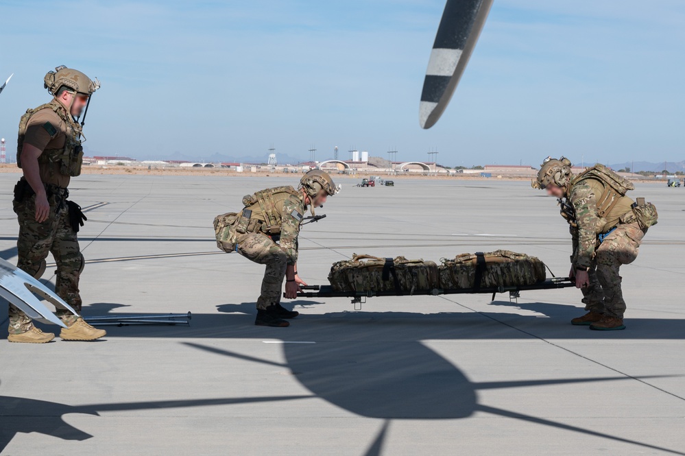 U.S. Air Force and Italian Air Commandos conduct medical training on a C-146A Wolfhound during Emerald Warrior 25.1