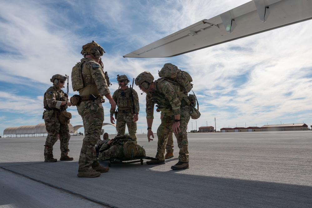 U.S. Air Force and Italian Air Commandos conduct medical training on a C-146A Wolfhound during Emerald Warrior 25.1