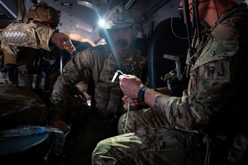 U.S. Air Force and Italian Air Commandos conduct medical training on a C-146A Wolfhound during Emerald Warrior 25.1