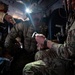 U.S. Air Force and Italian Air Commandos conduct medical training on a C-146A Wolfhound during Emerald Warrior 25.1