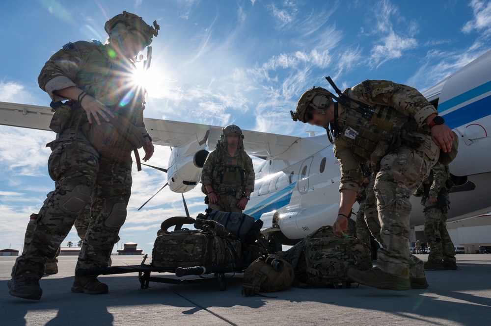 U.S. Air Force and Italian Air Commandos conduct medical training on a C-146A Wolfhound during Emerald Warrior 25.1