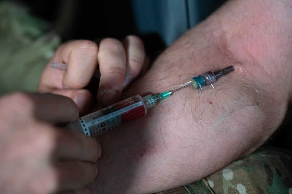 U.S. Air Force and Italian Air Commandos conduct medical training on a C-146A Wolfhound during Emerald Warrior 25.1