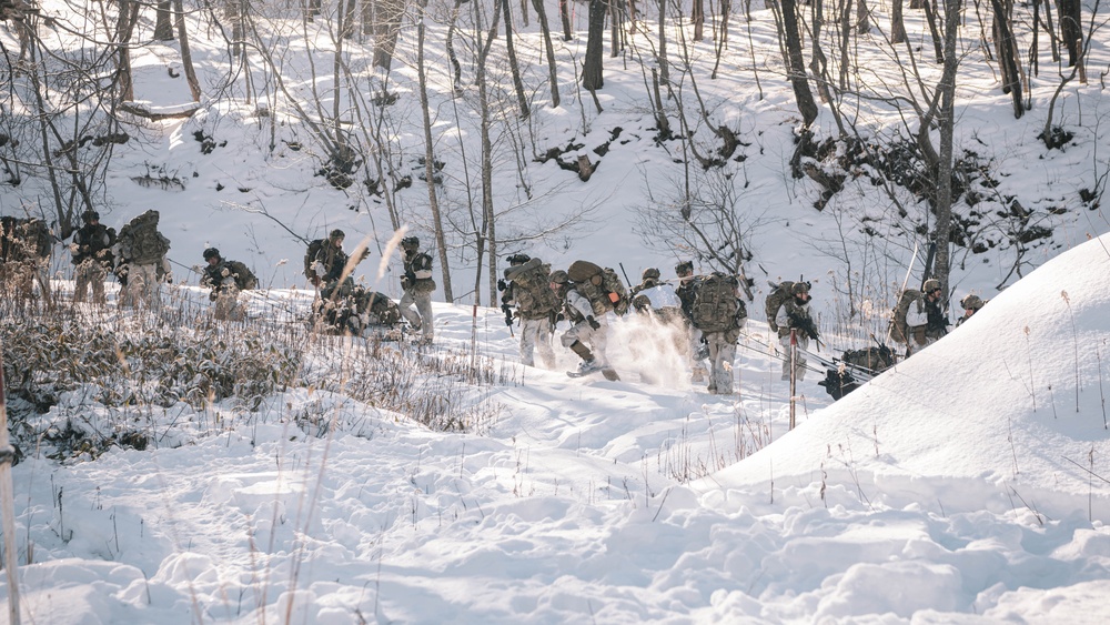 U.S. Army Soldiers move toward the objective