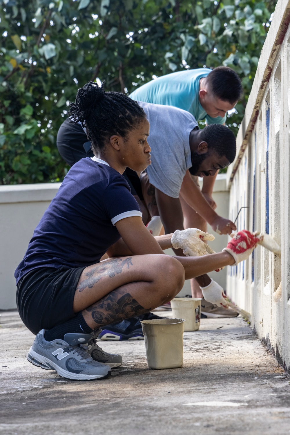 Marines, Sailors paint to revitalize Guam