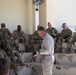 National Service Academy instructor teaches Best Warrior Competitors weapons familiarization class
