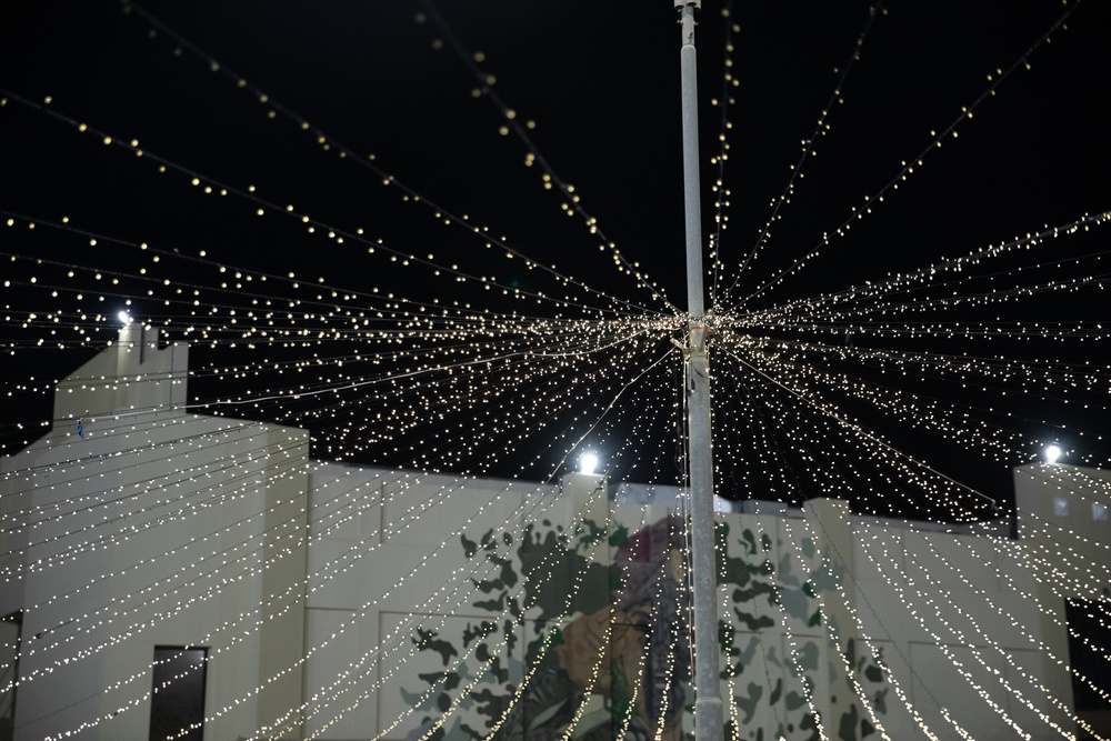 West Virginia, District of Columbia National Guard Members, and Qatar National Service Academy cadets enjoy traditional Qatari food prepared and served by staff at the National Service Academy