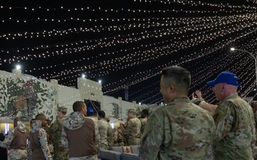 West Virginia, District of Columbia National Guard Members, and Qatar National Service Academy cadets enjoy traditional Qatari food prepared and served by staff at the National Service Academy