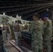 West Virginia, District of Columbia National Guard Members, and Qatar National Service Academy cadets enjoy traditional Qatari food prepared and served by staff at the National Service Academy