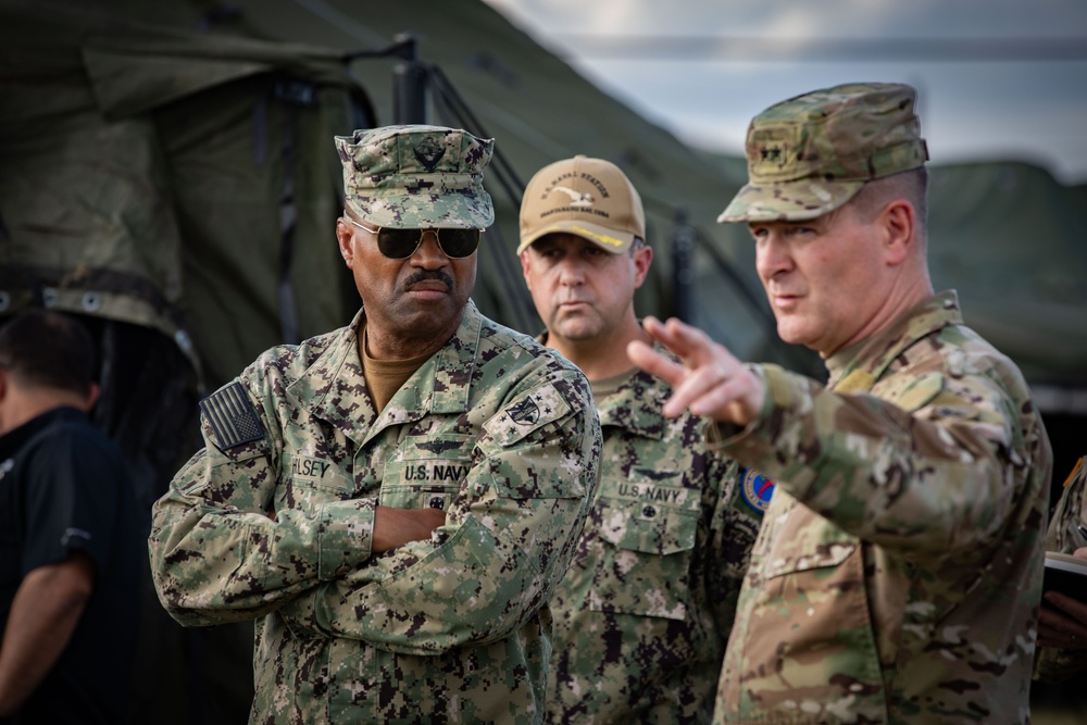 Admiral Alvin Holsey visits illegal aliens holding operations center at Naval Station Guantanamo Bay