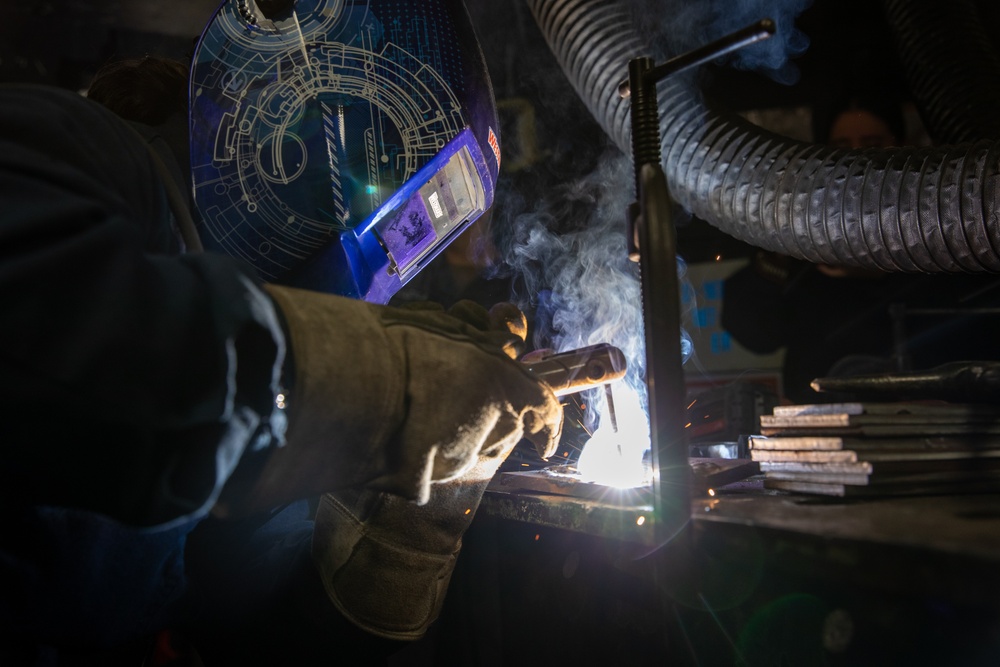 USS George Washington (CVN 73) Sailors weld parts