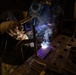 USS George Washington (CVN 73) Sailors weld parts