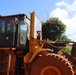 A Bulldozer is Fitted with a Three-Inch Plexiglass Shield to Protect the Operator During UXO Operations