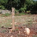 A Marker Shows the Final Depth of Ground Clearance Achieved for a Construction Site