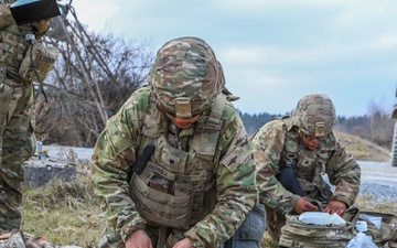 Soldiers from 41st FAB conduct medical assessments on simulated casualties during brigade evaluation exercise