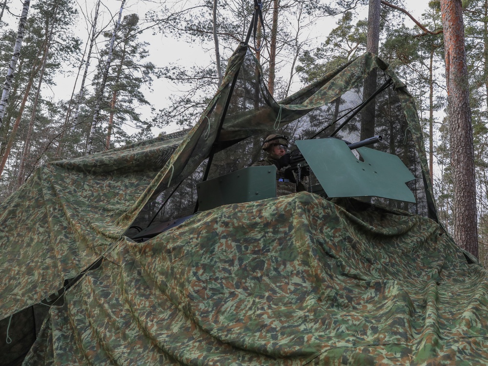 Soldiers from the 41st Field Artillery Brigade execute a surprise attack during Brigade live-fire exercise