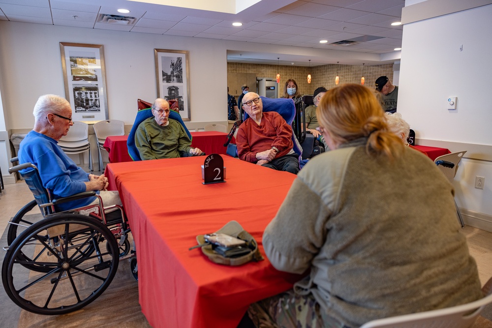 Airmen from the 109th Airlift Wing attend a lunch with veterans