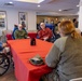 Airmen from the 109th Airlift Wing attend a lunch with veterans