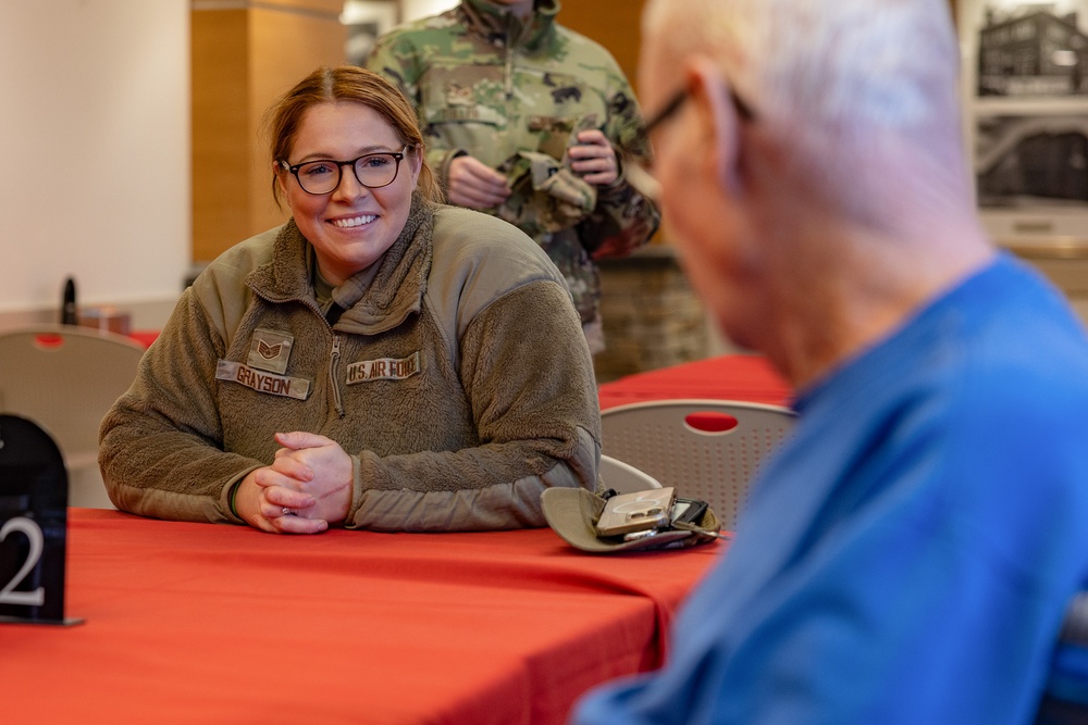 Airmen from the 109th Airlift Wing attend a lunch with veterans