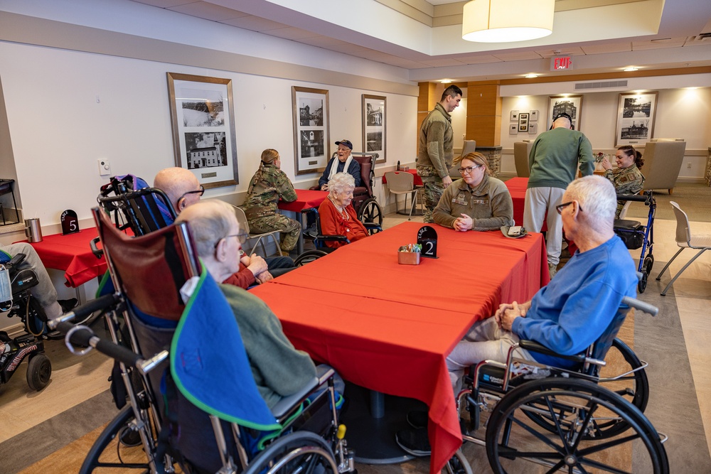 Airmen from the 109th Airlift Wing attend a lunch with veterans