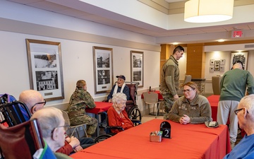 Airmen from the 109th Airlift Wing attend a lunch with veterans